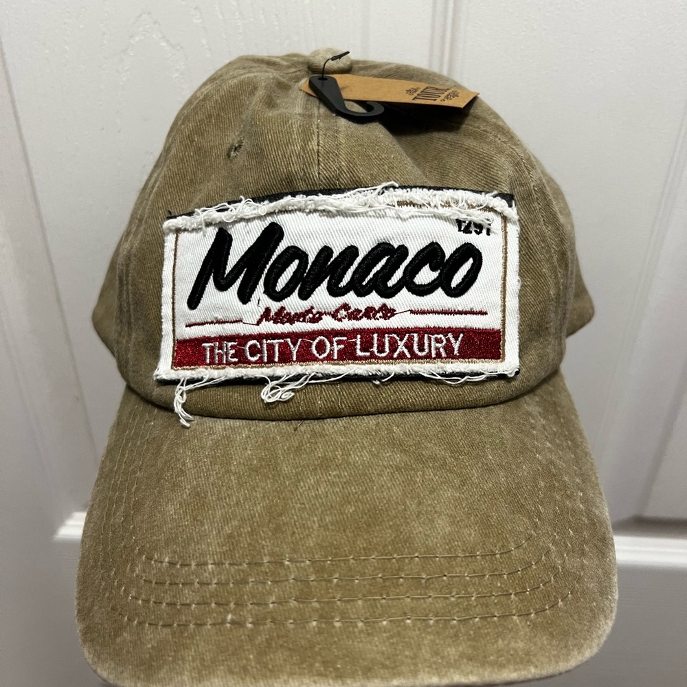 Brand new with tag...baseball cap purchased in Monaco as a souvenir. Sandy beige